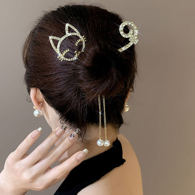 Rhinestone hairpin pearl bun artifact